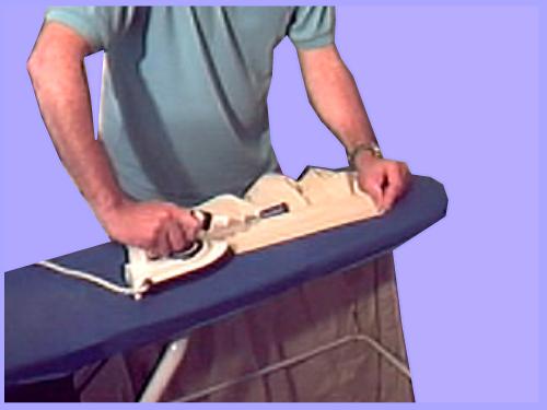 Ironing the collar on a dress